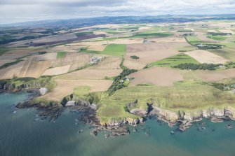 General oblique aerial view of the Aberdeenshire landscape centred on Castle of Cadden.