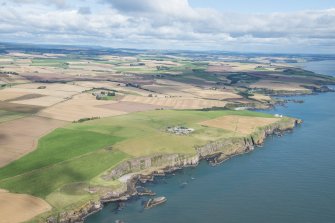 General oblique aerial view of the Aberdeenshire landscape centred on Adam's Castle and Todhead Lighthouse.