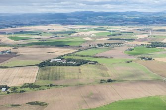 General oblique aerial view of the Aberdeenshire landscape centred on the village of Roadside of Kinneff.