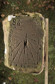 View of sundial on top surface of cross slab (including scale)