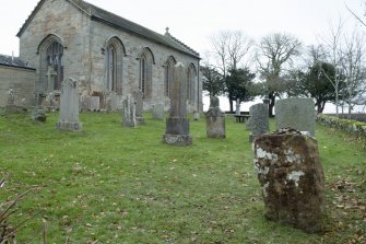 View showing stone in setting of churchyard