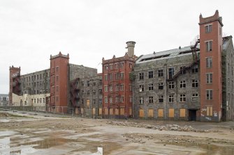 General view from South West of New or North Mill (left), Old Mill (centre) and South Mill (right) with 1920s red brick additions.