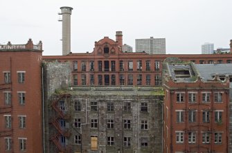 Sewing Mill (1904). View from 3rd floor looking east towards New North and South Mills (1913-14). Old Mill in foreground.