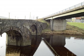 View from east showing concrete road bridge to north