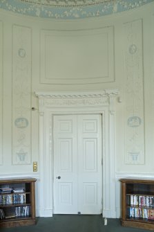 Ground floor. Oval drawing room, door and plaster panels.