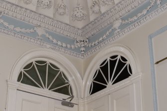 2nd floor. Stair hall, detail of cornice and fanlights.