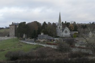 General view of church and hamlet and castle of Borthwick from east.