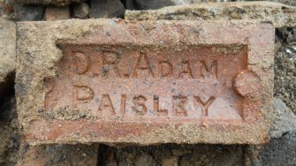 Close up of brick from rubble / made-up ground, direction