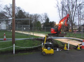 Lawn and route of cable set out inbetween plywood boards, direction NW