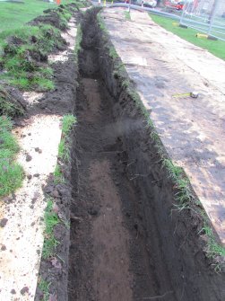 Working shot with subsoil showing in foreground, direction E