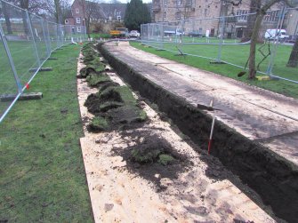 Setting shot of completed trench, direction E