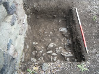 Trench 1. Detail of the stone rubble layer (002), direction E
