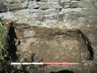 Trench 3. Stone and mortar rubble at base of N wall, direction N