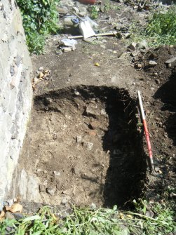 Trench 3. Stone and mortar rubble at base of N wall, direction E