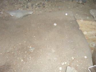 Inscription on slab spanning across burial chamber, direction S