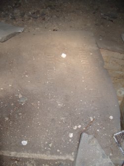 Inscription on slab spanning across burial chamber, direction S