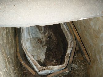 W end of lead coffin within burial crypt, direction E