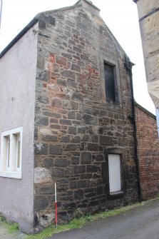 Detail of the west gable end of the Inn (Building F), direction facing E