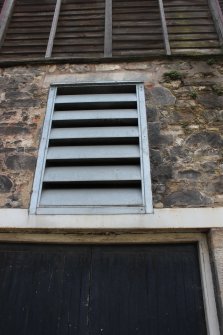 Detail of the vent above the goods entrance on the north wall of building C, direction facing SW