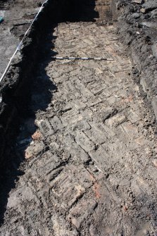 Brick floor at NE end of trench 2, facing SW