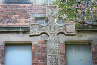 Memorial cross to the front of the school building