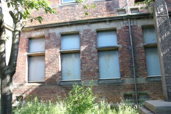 Central window bays of the front elevation ground floor, facing N