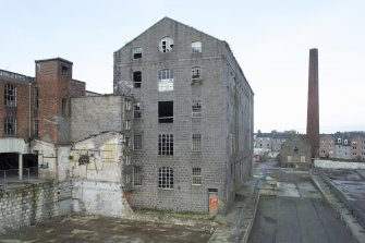 View of Sewing Mill (1904) from south. Taken from Hackling Department building, attic floor with demolished weaving shed area below.
