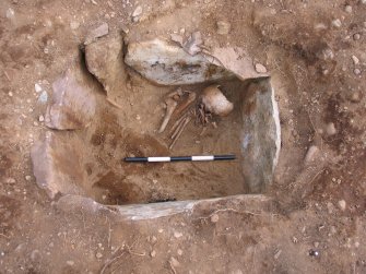 Plate 3: View of human remains in cist associated with the excavation of a cist and cremation burials at Slacknamarnock Quarry, Inverness