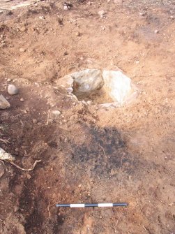 Plate 4: Pre-ex view of burnt spread 003 and scoop 009 (containing double cremation burial) associated with the excavation of a cist and cremation burials at Slacknamarnock Quarry, Inverness