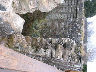 damaged area of wall from above, facing SE
