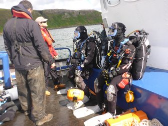 Photograph with detail of diver investigation onto the Iris