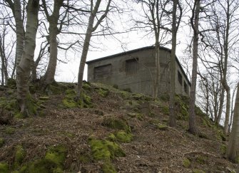General view showing rounded wall of Blockhouse No. 4 (Inner Ring), from east.