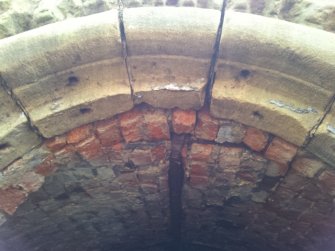 Head of ice house entrance showing drilled holes