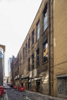 Rear of building from north showing fire damage.