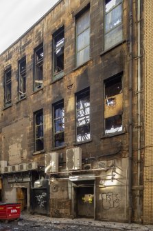 Rear of building from north showing fire damage.