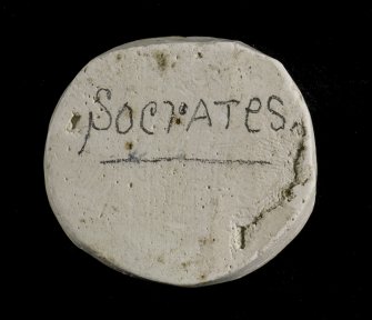 Verso of plaster cast intaglio of two men's heads inscribed 'Socrates'.