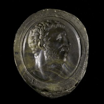 Hard stone intaglio of a bearded man's head.