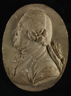 Plaster cast intaglio of a man's head inscribed 'B M Smith'.