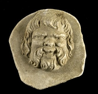 Plaster cast intaglio of a bearded man's face (same image as object 7).