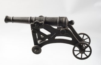 Cast iron model of a cannon.