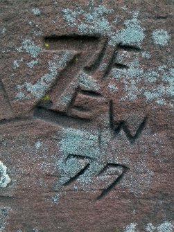 An example of graffiti visible on pedestal.
