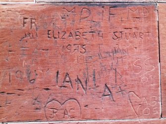 An example of graffiti visible on pedestal.