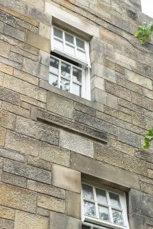 View of re-used stone inscription in Latin.