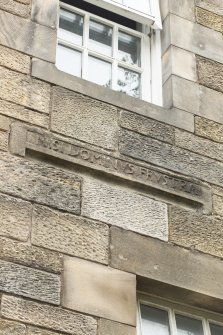 Detail of re-used stone inscription in Latin.