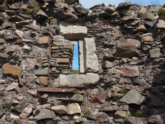 Interior. Window in NW room of lower storey.