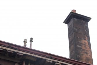 Detail of chimney and decorative drain finials.