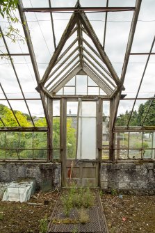 Detail of arched doorway in the easternmost section of greenhouse, Walled Garden, Housedale, Dunecht House.