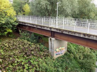 View of graffiti on footbridge taken from road bridge (NS66SW 258) to W.