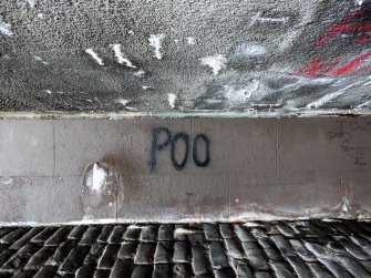 View of graffiti written on the underside of the bridge.