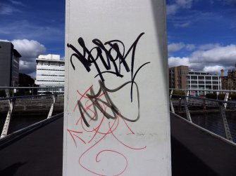 Examples of two graffiti tags on the superstructure of the bridge.